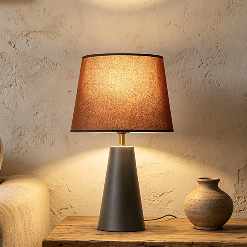 Modern bedside table lamp with linen shade and black metal base
