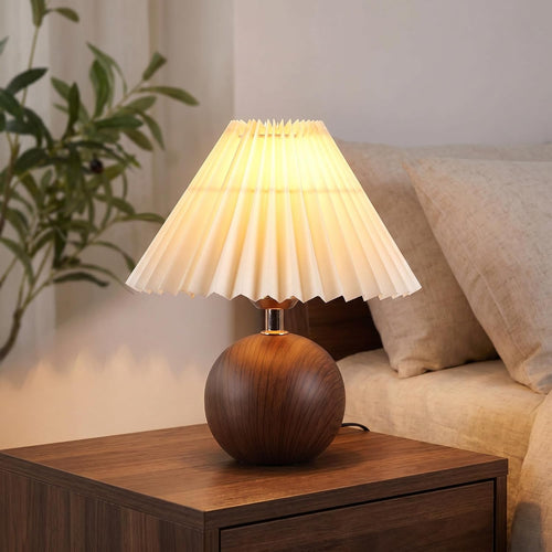Ceramic globe table lamp with walnut base and beige linen shade